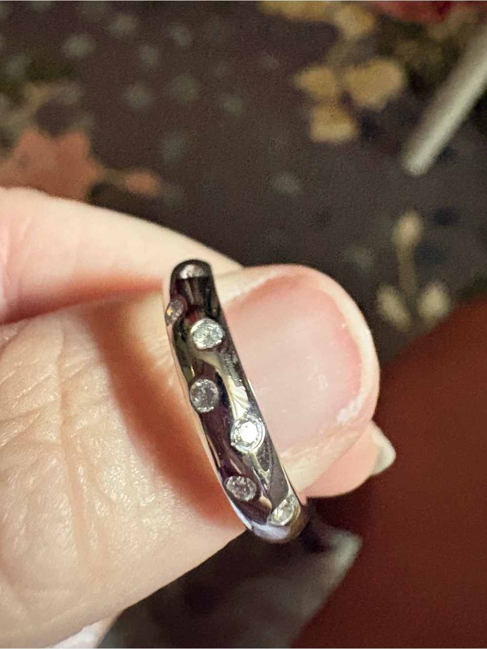 White gold band with 7 diamonds size 7